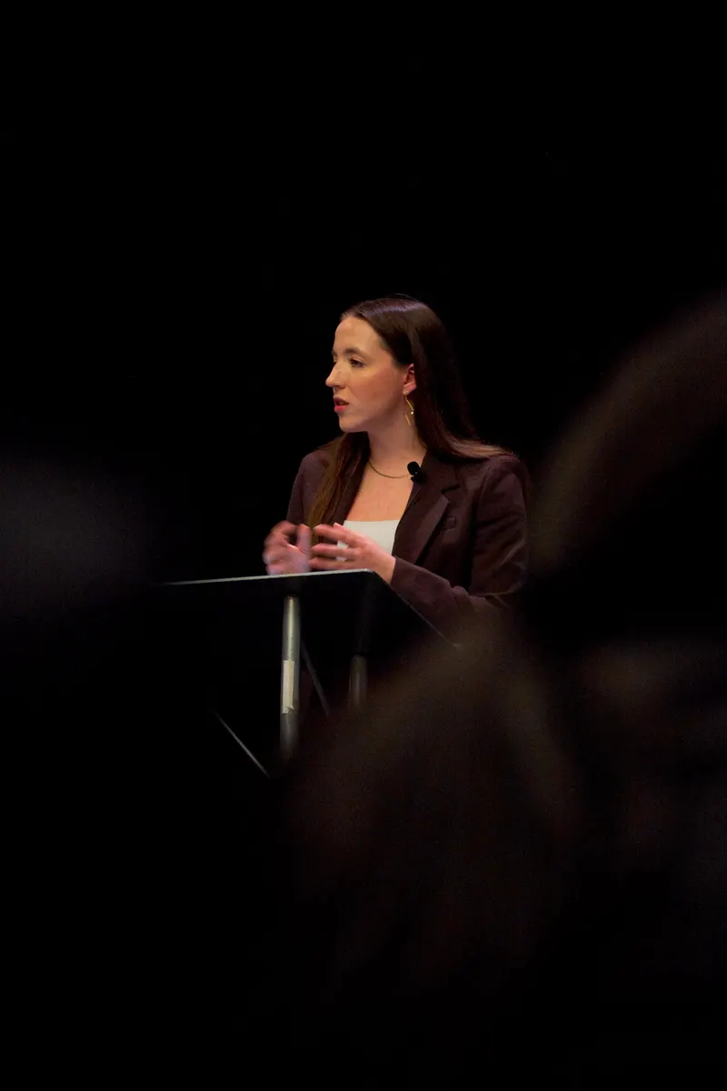 LeahV Solutions speaker presenting on stage